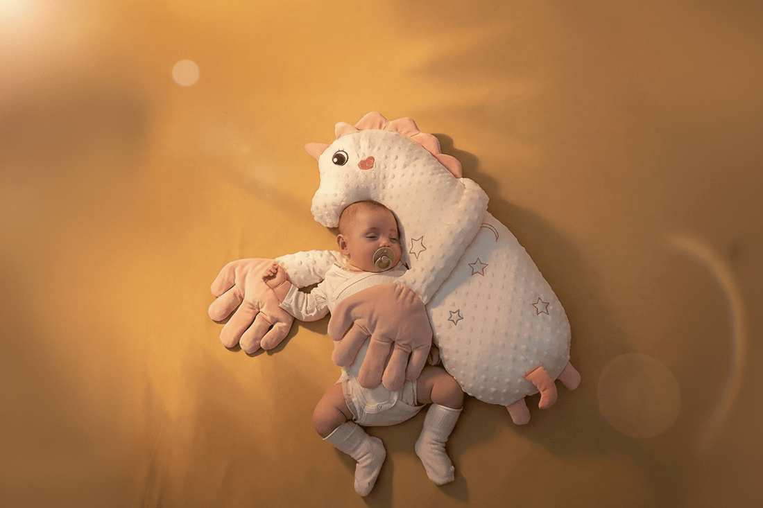 Doudou d'enfance licorne tapoteur bébé dort