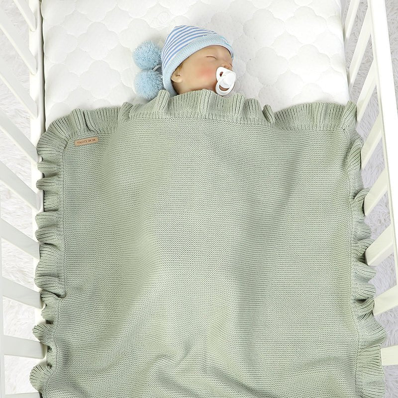 couverture bébé tricot Cocooning gris bébé dort lit