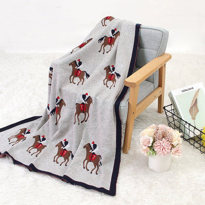 couverture en laine pour bebe chevalier étendu chaise