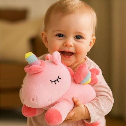 doudou licorne douceur magique bébé rose fillette souriante embrasse