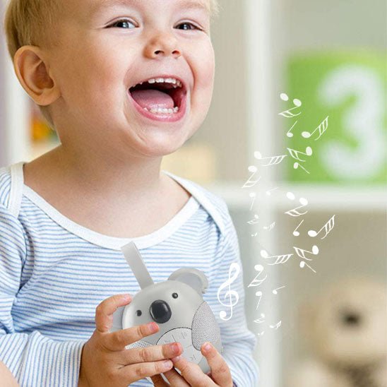 veilleuse bruit blanc koala dans les mains enfant joyeux